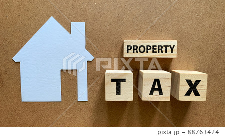 Top view of property tax text on wooden blocks. Tax concept. Top view of property tax text on wooden blocks. Tax concept. 88763424