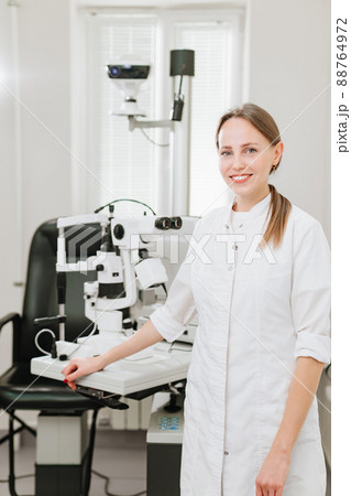 Attractive woman ophthalmologist in ophthalmology clinic. optics salon. Attractive woman ophthalmologist in ophthalmology clinic. optics salon. 88764972