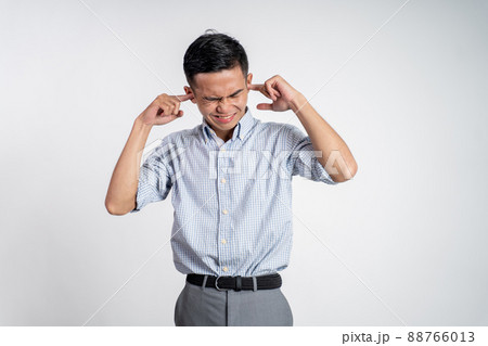 Stressed asian young young man holding head 88766013