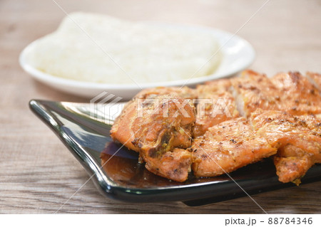 roasted slice chicken breast eat with sticky rice on plate 88784346