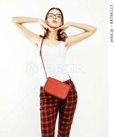 young pretty stylish hipster girl posing emotional isolated on white background happy smiling cool smile, lifestyle people concept close up 88786113