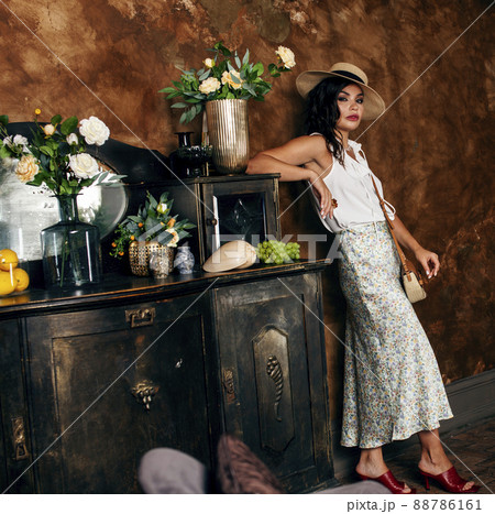 young pretty rich italian woman in golden luxury room interior, elegant styled hotel, people on vacation young pretty rich italian woman in golden luxury room interior, elegant styled hotel, people on vacation 88786161