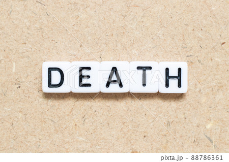 White tile alphabet letter with word death on wood background 88786361