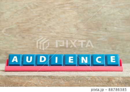 Tile alphabet letter with word audience in red color rack on wood background Tile alphabet letter with word audience in red color rack on wood background 88786385