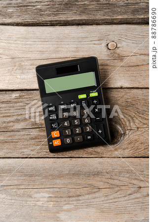 Calculator on wooden background. Top view Calculator on wooden background. Top view 88786690
