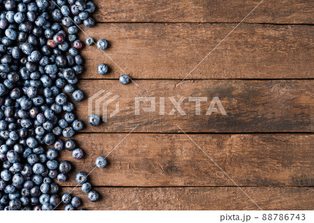 Fresh blueberries on wooden table. Top view 88786743