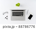 Elegant office desktop. Laptop and business accessories on white table. Top view 88786776