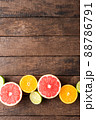 Juicy citruses on wooden table. Top view 88786791
