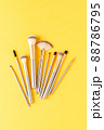 Gold makeup brushes. Top view 88786795