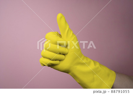 a yellow rubber cleaning glove a yellow rubber cleaning glove 88791055