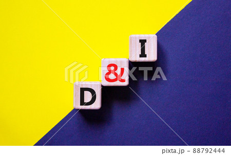 D and I, Diversity and inclusion symbol. Concept words D and I, diversity and inclusion on wooden cubes on beautiful blue background. Business, D and I, diversity and inclusion concept. 88792444