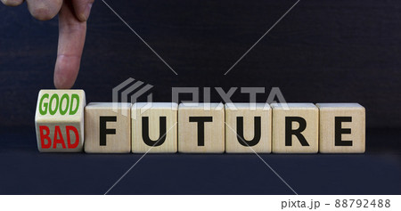Good or bad future symbol. Turned wooden cubes and changed concept words Bad future to Good future. Beautiful grey table grey background, copy space. Business bad or good future concept. 88792488