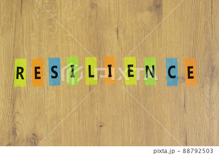 Resilience success symbol. The concept word Resilience on colored papers on a beautiful wooden background. Business and resilience success concept, copy space. Resilience success symbol. The concept word Resilience on colored papers on a beautiful wooden background. Business and resilience success concept, copy space. 88792503