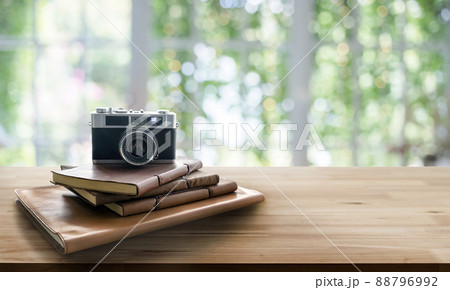 vintage film photo camera with letther book on wood table in banne vintage film photo camera with letther book on wood table in banne 88796992
