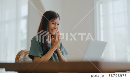Excited asian female feeling euphoric celebrating online win success achievement result Excited asian female feeling euphoric celebrating online win success achievement result 88798973