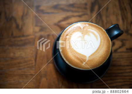 cappuccino or Latte art coffee made from milk on wood table 88802664