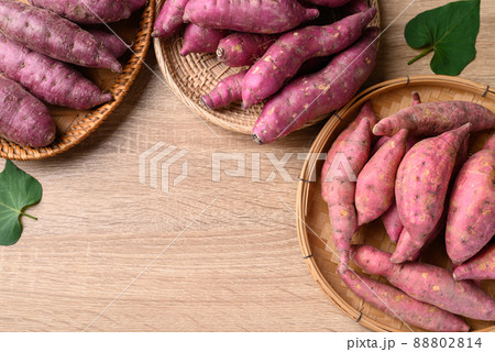 Various sweet potato in basket on wooden background, Table top view 88802814