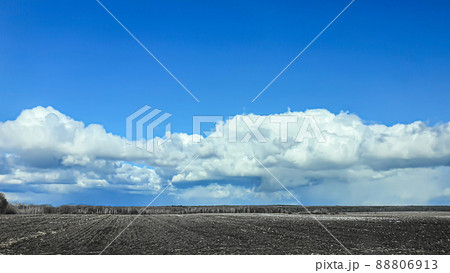 Sowing time in Ukraine during the war. Preparing fields for sowing grain. Blue sky, plowed land. terror. Sowing time in Ukraine during the war. Preparing fields for sowing grain. Blue sky, plowed land. terror. 88806913