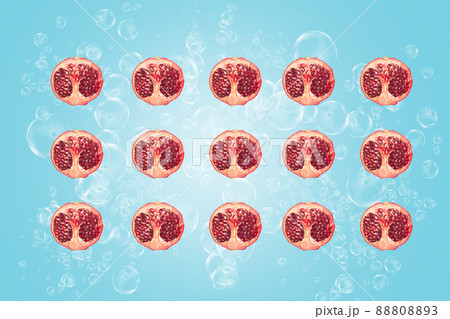 Symmetrical composition of pomegranate slices on blue background. Top view. Symmetrical composition of pomegranate slices on blue background. Top view. 88808893