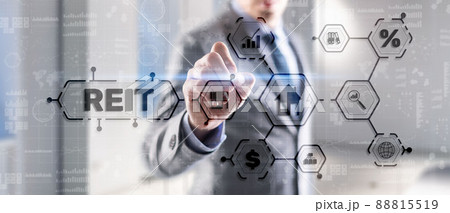 REIT. Real estate investment trust. Financial Market. Hand pressing button on screen REIT. Real estate investment trust. Financial Market. Hand pressing button on screen 88815519