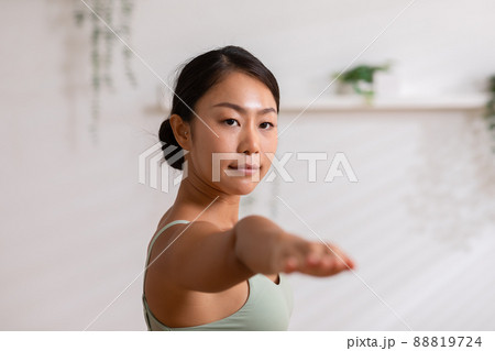 Side view of Asian woman wearing green sportwear doing Yoga exercise,Yoga Child pose or Balasana,Calm of healthy young woman breathing and meditation with yoga at home Side view of Asian woman wearing green sportwear doing Yoga exercise,Yoga Child pose or Balasana,Calm of healthy young woman breathing and meditation with yoga at home 88819724