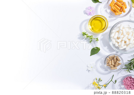 Flat lay composition of various vitamin capsules and dietary supplements isolated on white background with copy space. Flat lay composition of various vitamin capsules and dietary supplements isolated on white background with copy space. 88820318