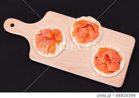 Tasty Rice Cake Sandwiches with Fresh Salmon Slices Tasty Rice Cake Sandwiches with Fresh Salmon Slices 88820399