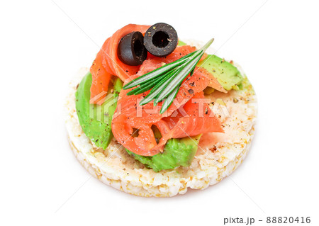 Rice Cake Sandwich with Fresh Salmon, Avocado and Olives - Isolated Rice Cake Sandwich with Fresh Salmon, Avocado and Olives - Isolated 88820416