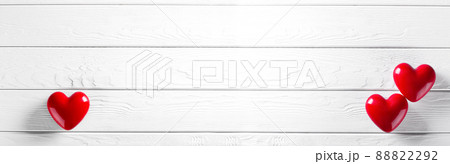 Two Red Heart shapes on wooden rustic background 88822292