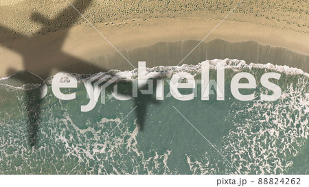 Seychelles word being revealed with the shadow of a flying airplane on the beach Seychelles word being revealed with the shadow of a flying airplane on the beach 88824262