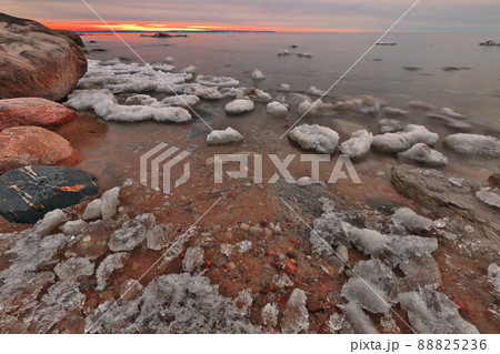 The Last of Winter's Ice Melts Along the Shore of Georgian Bay off the Great Lakes at Twilight The Last of Winter's Ice Melts Along the Shore of Georgian Bay off the Great Lakes at Twilight 88825236