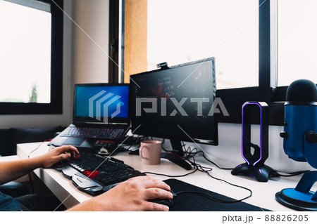 hands of a young man working as a programmer from home on his computer. 88826205