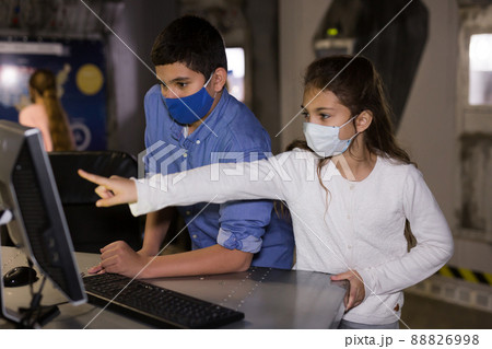 Group of friendly kids are concentrating on finding a way out of bunker room 88826998