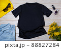 Womens black T-shirt mockup with yellow flowers 88827284