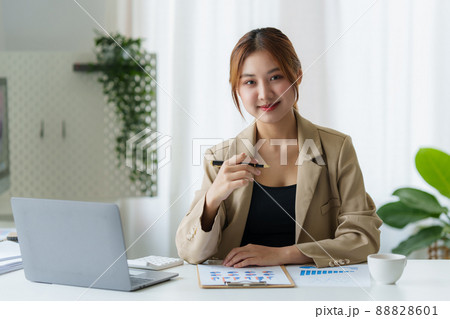 Modern Asian Business woman have confident working with financial at office. Accounting concept. Modern Asian Business woman have confident working with financial at office. Accounting concept. 88828601