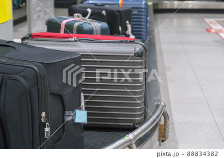 Suitcase or luggage with conveyor belt in the airport Suitcase or luggage with conveyor belt in the airport 88834382