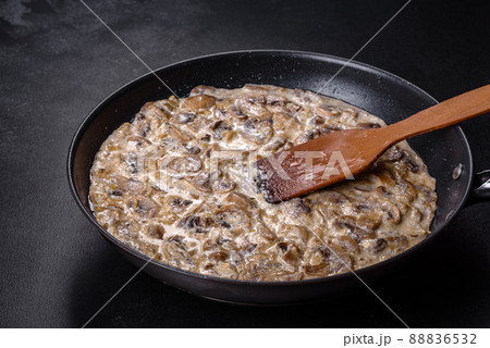 Delicious fresh young champignons sliced into slices in creamy sauce Delicious fresh young champignons sliced into slices in creamy sauce 88836532