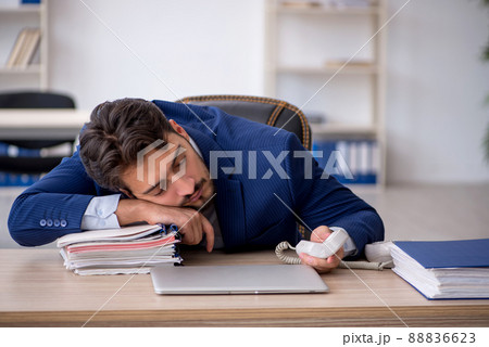Young male employee extremely tired in the office 88836623