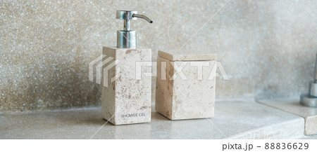 Toiletries bottles in bathroom at luxury hotel or modern home. body shower gel in ceramic ware with wall background Toiletries bottles in bathroom at luxury hotel or modern home. body shower gel in ceramic ware with wall background 88836629