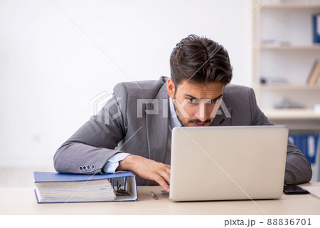 Young male employee working in the office 88836701