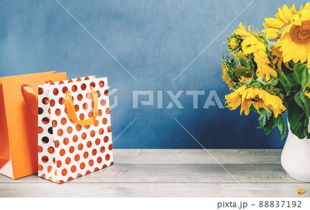 Sunflowers bouquet in a floral arrangementon a table 88837192