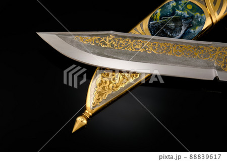 collectible silver dagger with scabbard on black 88839617