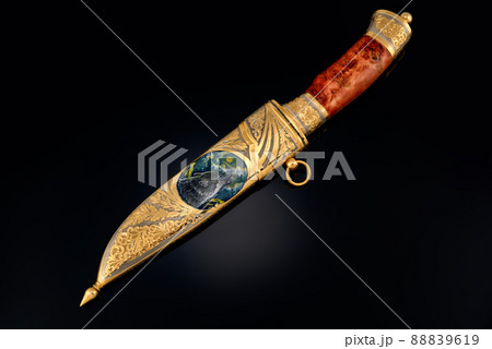 collectible silver dagger with scabbard on black 88839619