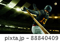 Poster with professional baseball player with baseball bat in action during match in crowed sport stadium at evening time. Sport, win, winner, competition concepts. 88840409