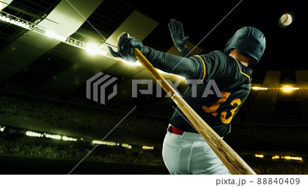 Poster with professional baseball player with baseball bat in action during match in crowed sport stadium at evening time. Sport, win, winner, competition concepts. 88840409