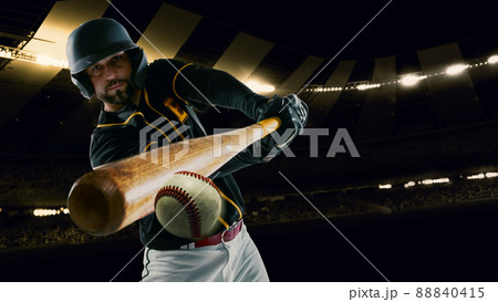 Poster with professional baseball player with baseball bat in action during match in crowed sport stadium at evening time. Sport, win, winner, competition concepts. 88840415