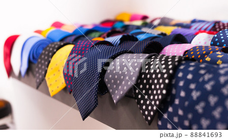 row of Neckties on hangers in men clothing store row of Neckties on hangers in men clothing store 88841693