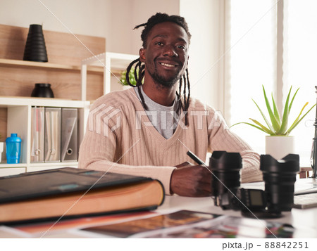 Male photographer working in home office 88842251