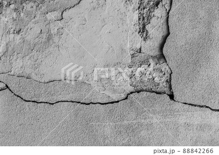 Old crack broken gray concrete wall damage background grey cracked texture Old crack broken gray concrete wall damage background grey cracked texture 88842266