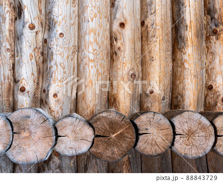 Log house wall background. Construction of a wooden eco-friendly house from natural materials. Pattern and texture of wood masonry Log house wall background. Construction of a wooden eco-friendly house from natural materials. Pattern and texture of wood masonry 88843729